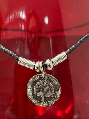 Necklace with a pendant made from an authentic coin a silver-plated 25 Centavos
